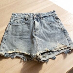 Blue Jean shirts. Size large. Not much stretch. Distressed.